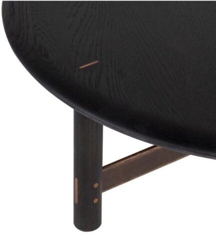 district eight stilt round coffee table detail ebonized oak